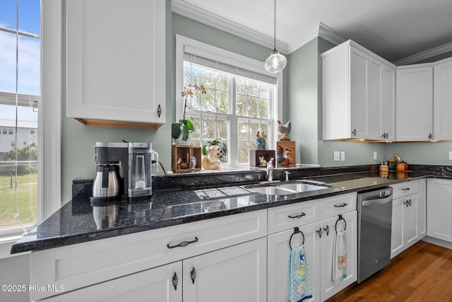 208 Sea Manor Dr, Surf City, NC 28445 - kitchen with dishwasher, ornamental molding, a sink, white cabinetry, and wood finished floors