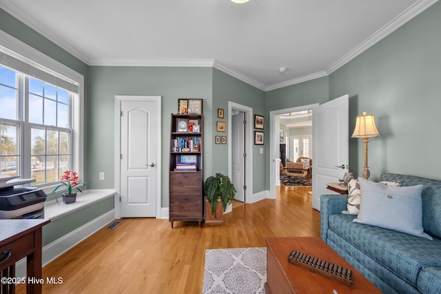 208 Sea Manor Dr, Surf City, NC 28445 - living area featuring light wood-style floors, healthy amount of natural light, ornamental molding, and baseboards