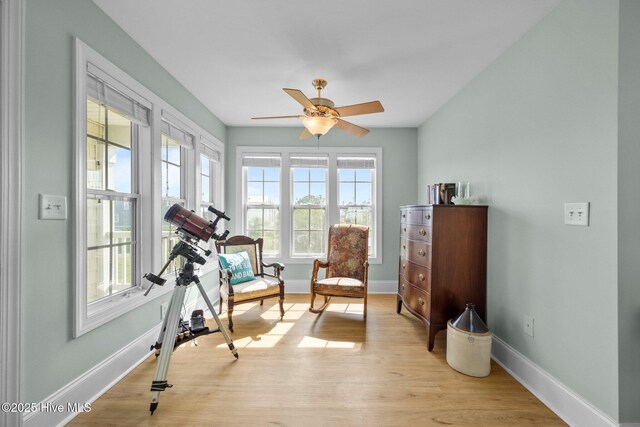 208 Sea Manor Dr, Surf City, NC 28445 - sitting room with plenty of natural light, baseboards, light wood-style floors, and a ceiling fan
