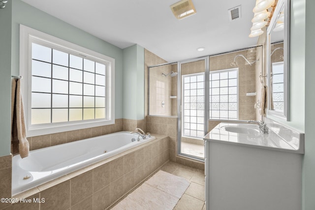 208 Sea Manor Dr, Surf City, NC 28445 - bathroom with a stall shower, a garden tub, tile patterned floors, and vanity