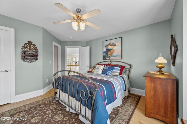 208 Sea Manor Dr, Surf City, NC 28445 - bedroom featuring wood finished floors, baseboards, and a ceiling fan