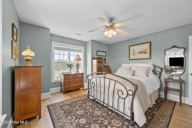 208 Sea Manor Dr, Surf City, NC 28445 - bedroom featuring wood finished floors, baseboards, and a ceiling fan