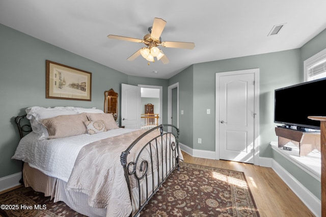 208 Sea Manor Dr, Surf City, NC 28445 - bedroom with wood finished floors, baseboards, and ceiling fan