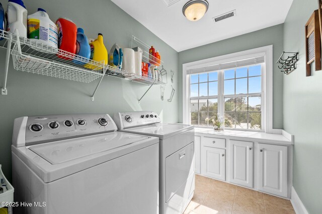 208 Sea Manor Dr, Surf City, NC 28445 - laundry room featuring washing machine and clothes dryer, light tile patterned floors, and baseboards
