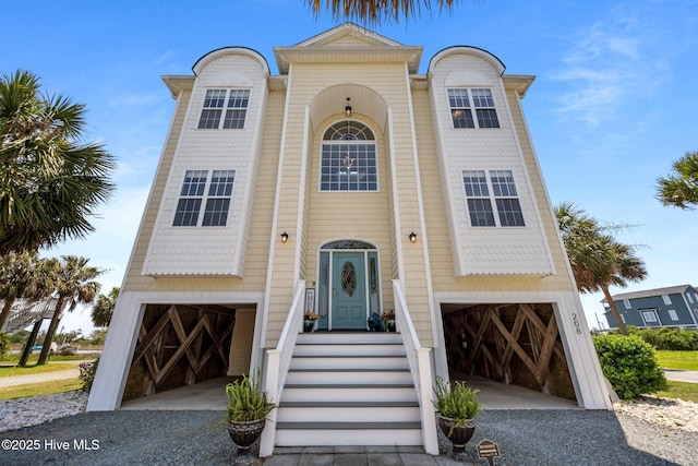 208 Sea Manor Dr, Surf City, NC 28445 - view of front of home with gravel driveway and a garage