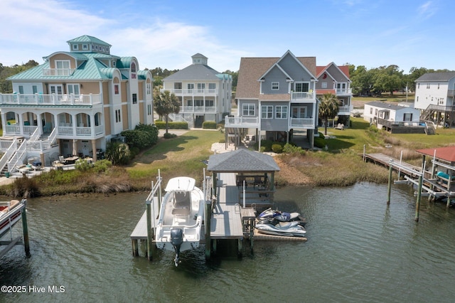 208 Sea Manor Dr, Surf City, NC 28445 - dock featuring boat lift, a water view, and a balcony