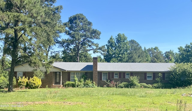 691 Wade Daughtry Rd, Faison, NC 28341 - ranch-style house featuring brick siding, a chimney, and metal roof