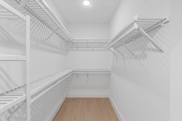 1100 S Sixth St, Carolina Beach, NC 28428 - spacious closet with light wood-style flooring