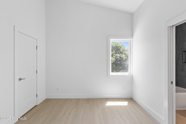 1100 S Sixth St, Carolina Beach, NC 28428 - unfurnished bedroom featuring light wood-type flooring and baseboards