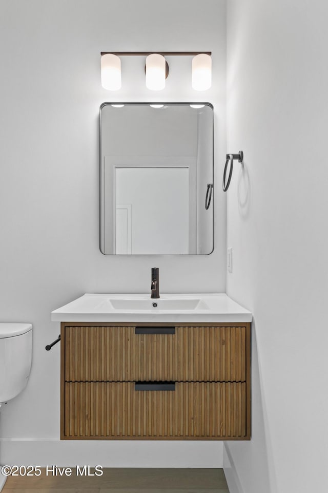 1100 S Sixth St, Carolina Beach, NC 28428 - bathroom with toilet and vanity