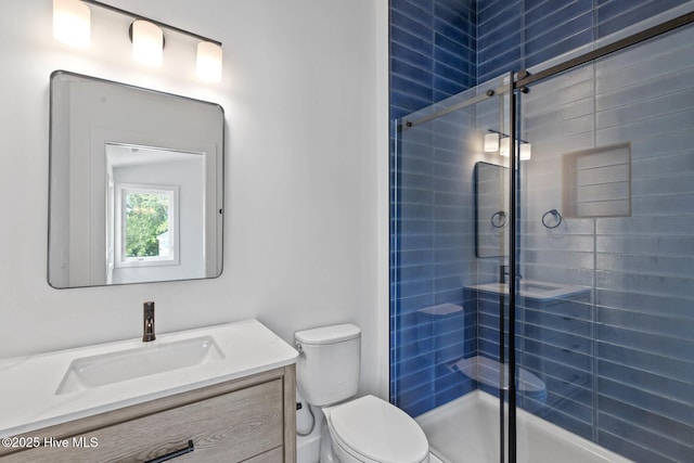 1100 S Sixth St, Carolina Beach, NC 28428 - full bath featuring toilet, a shower stall, and vanity