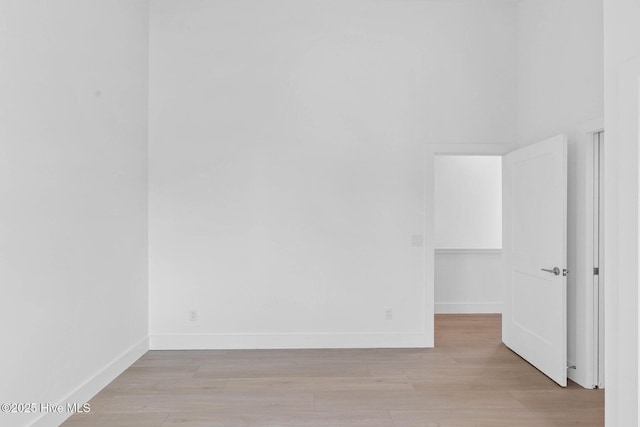 1100 S Sixth St, Carolina Beach, NC 28428 - spare room featuring light wood-style flooring and baseboards