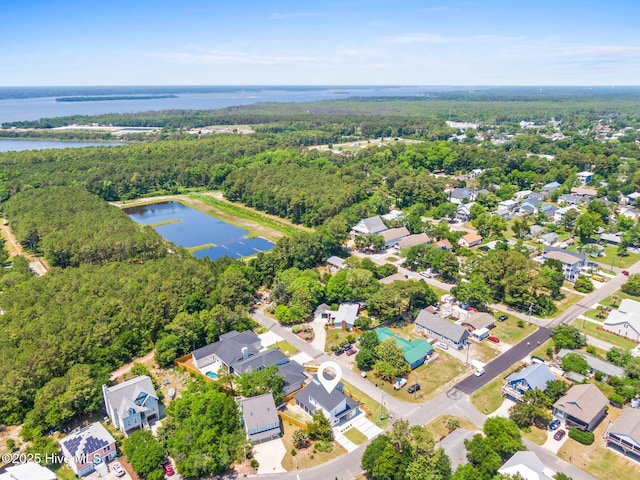 1100 S Sixth St, Carolina Beach, NC 28428 - aerial view of residential area with a nearby body of water and a heavily wooded area