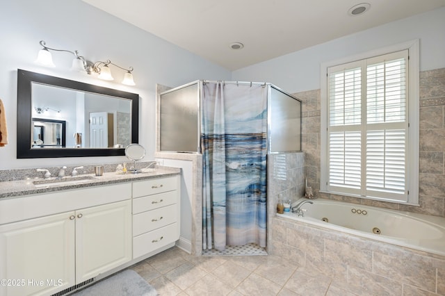 482 Riverwood Dr SE, Bolivia, NC 28422 - full bath featuring a shower stall, a jetted tub, vanity, and tile patterned flooring