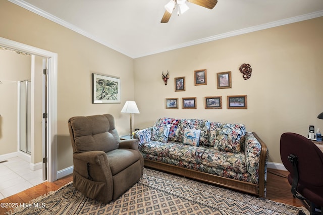 482 Riverwood Dr SE, Bolivia, NC 28422 - living room featuring ceiling fan, ornamental molding, baseboards, and wood finished floors