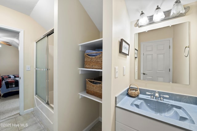 482 Riverwood Dr SE, Bolivia, NC 28422 - full bath with vanity, bath / shower combo with glass door, tile patterned flooring, vaulted ceiling, and baseboards