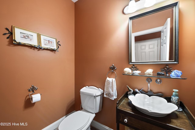482 Riverwood Dr SE, Bolivia, NC 28422 - half bath featuring baseboards, vanity, and toilet