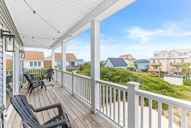 822 S Topsail Dr Unit B, Surf City, NC 28445 - wooden deck featuring a residential view