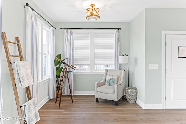 822 S Topsail Dr Unit B, Surf City, NC 28445 - living area featuring wood finished floors, baseboards, and a chandelier
