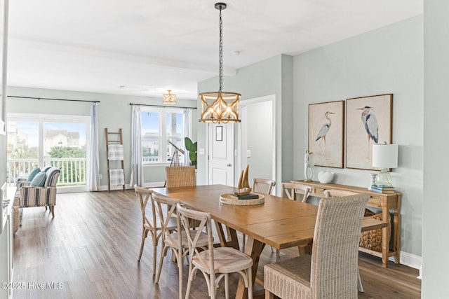 822 S Topsail Dr Unit B, Surf City, NC 28445 - dining space with a chandelier, wood finished floors, and baseboards