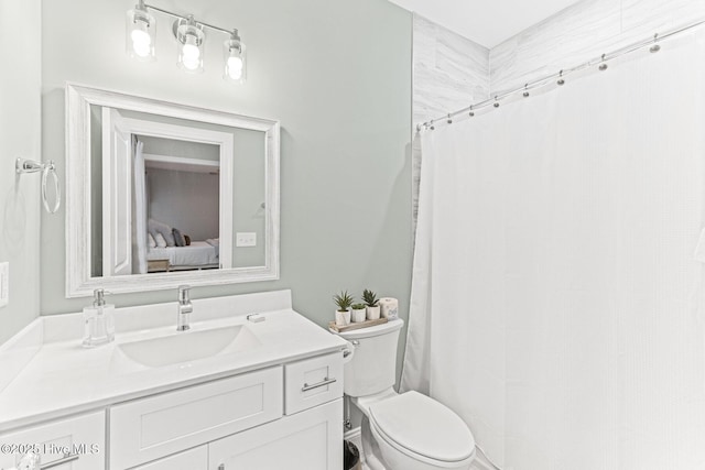 822 S Topsail Dr Unit B, Surf City, NC 28445 - bathroom with toilet, ensuite bath, and vanity