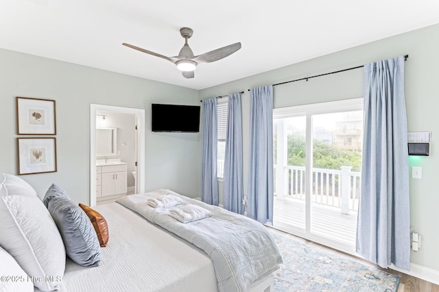 822 S Topsail Dr Unit B, Surf City, NC 28445 - bedroom featuring access to exterior, light wood finished floors, ensuite bath, baseboards, and a ceiling fan