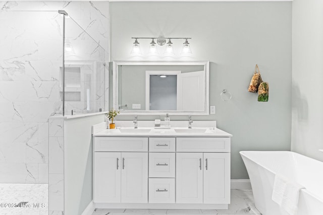 822 S Topsail Dr Unit B, Surf City, NC 28445 - bathroom with marble finish flooring, a marble finish shower, a freestanding bath, double vanity, and baseboards