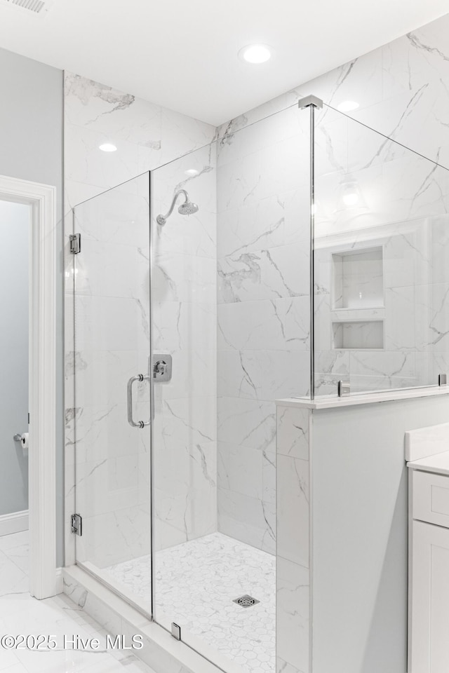822 S Topsail Dr Unit B, Surf City, NC 28445 - bathroom with a marble finish shower, marble finish flooring, recessed lighting, and vanity
