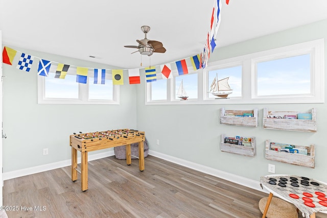 822 S Topsail Dr Unit B, Surf City, NC 28445 - playroom featuring ceiling fan, wood finished floors, and baseboards