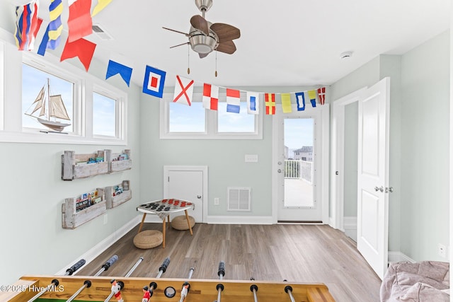 822 S Topsail Dr Unit B, Surf City, NC 28445 - playroom featuring wood finished floors, ceiling fan, and baseboards