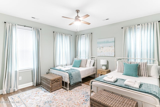 822 S Topsail Dr Unit B, Surf City, NC 28445 - bedroom featuring wood finished floors, baseboards, and a ceiling fan