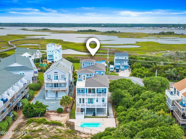 822 S Topsail Dr Unit B, Surf City, NC 28445 - aerial perspective of suburban area featuring a nearby body of water and a pool area
