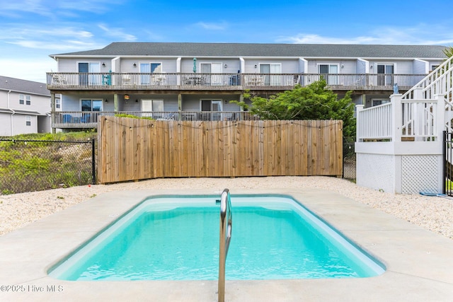 822 S Topsail Dr Unit B, Surf City, NC 28445 - view of swimming pool with a fenced backyard and stairway