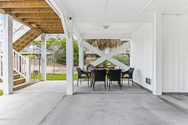 822 S Topsail Dr Unit B, Surf City, NC 28445 - view of patio with stairway and outdoor dining space