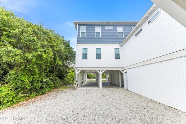 822 S Topsail Dr Unit B, Surf City, NC 28445 - rear view of property with a carport and driveway