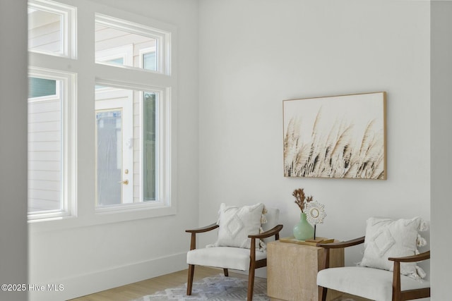 609 Augusta Ave, Carolina Beach, NC 28428 - sitting room featuring wood finished floors and baseboards
