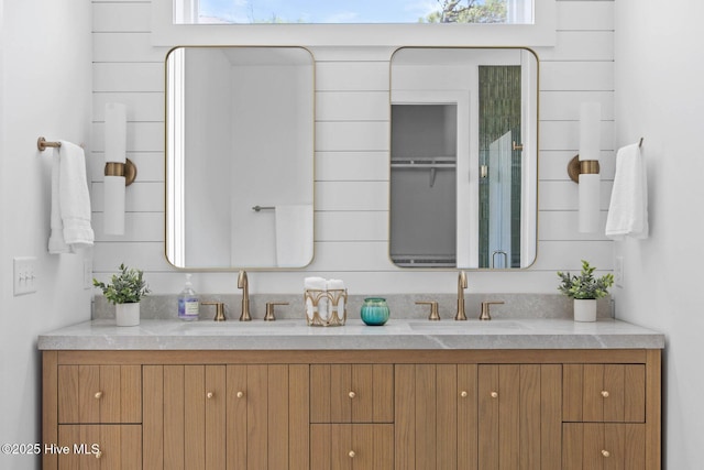 609 Augusta Ave, Carolina Beach, NC 28428 - full bath featuring double vanity and plenty of natural light