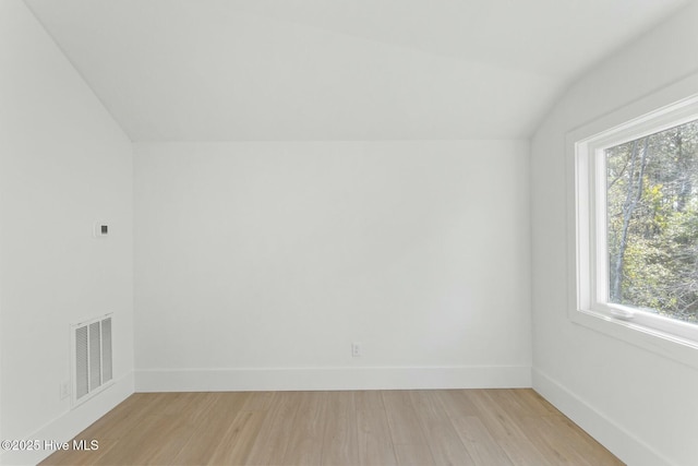 609 Augusta Ave, Carolina Beach, NC 28428 - additional living space featuring lofted ceiling, light wood-style floors, and baseboards