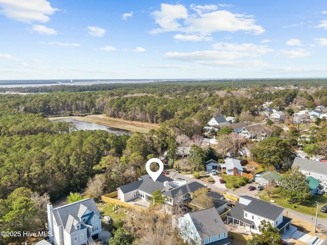 609 Augusta Ave, Carolina Beach, NC 28428 - aerial perspective of suburban area with a heavily wooded area and a nearby body of water