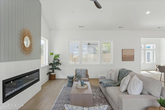 609 Augusta Ave, Carolina Beach, NC 28428 - living area featuring a ceiling fan, healthy amount of natural light, light wood-type flooring, a glass covered fireplace, and recessed lighting
