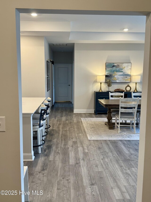 8941 Cobble Ridge Dr, Wilmington, NC 28411 - hall with dark wood-style floors, baseboards, and recessed lighting