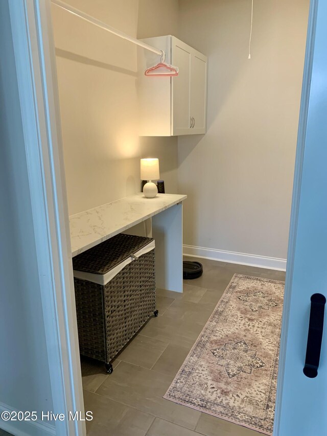 8941 Cobble Ridge Dr, Wilmington, NC 28411 - laundry area with baseboards and light tile patterned floors