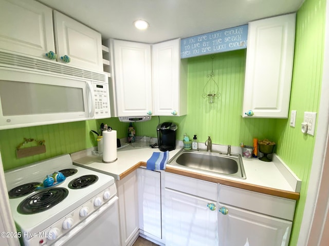1918 W Fort Macon Rd Unit 160, Atlantic Beach, NC 28512 - kitchen with white appliances, white cabinets, a sink, and light countertops