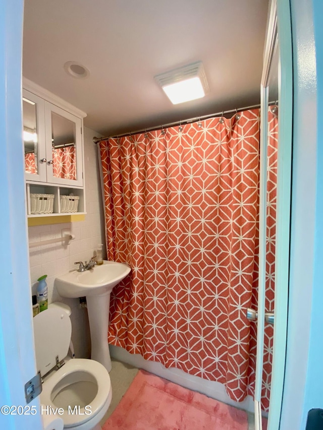 1918 W Fort Macon Rd Unit 160, Atlantic Beach, NC 28512 - full bathroom with toilet, tile walls, and curtained shower
