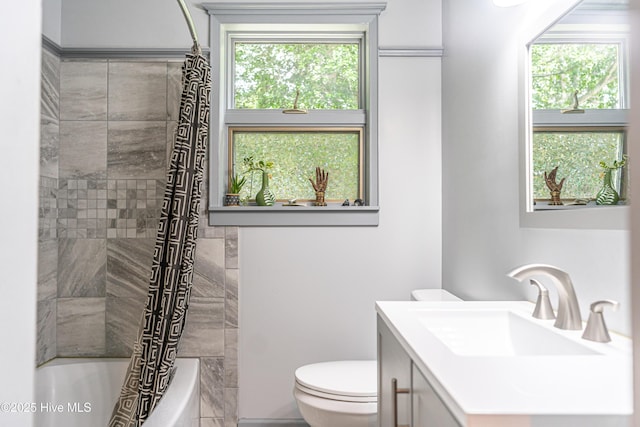 full bath with toilet, vanity, and shower / bathtub combination with curtain