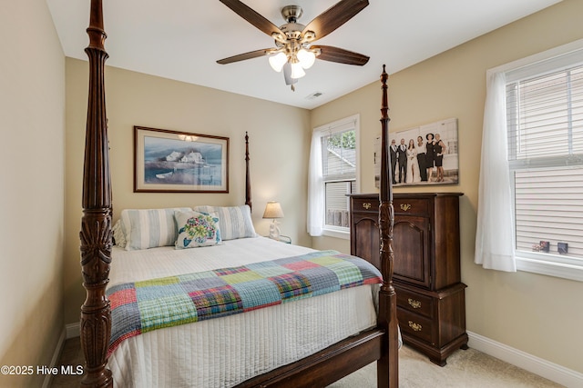 104 NE 63rd St, Oak Island, NC 28465 - bedroom with baseboards, light carpet, and ceiling fan