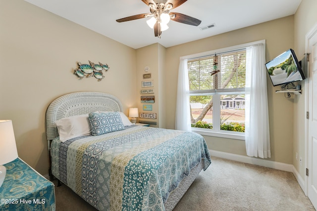 104 NE 63rd St, Oak Island, NC 28465 - carpeted bedroom with baseboards and ceiling fan