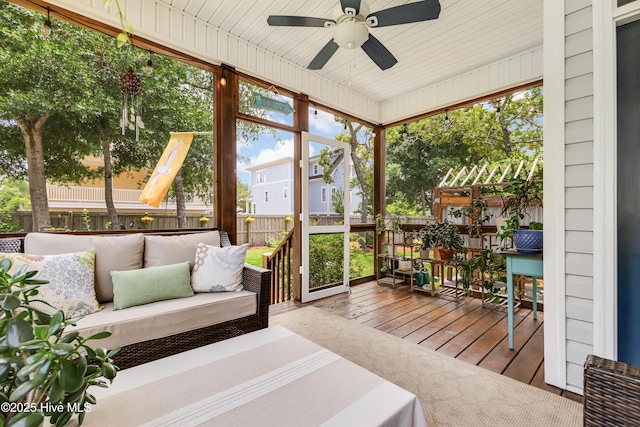104 NE 63rd St, Oak Island, NC 28465 - sunroom / solarium featuring ceiling fan and an outdoor living space
