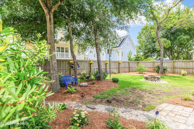 104 NE 63rd St, Oak Island, NC 28465 - view of yard with a fire pit