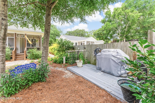 104 NE 63rd St, Oak Island, NC 28465 - view of yard featuring a deck and a sunroom